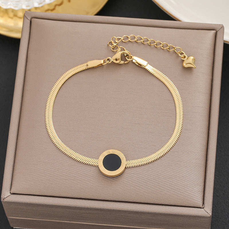 Pulsera con dije de círculo negro - acero inoxidable