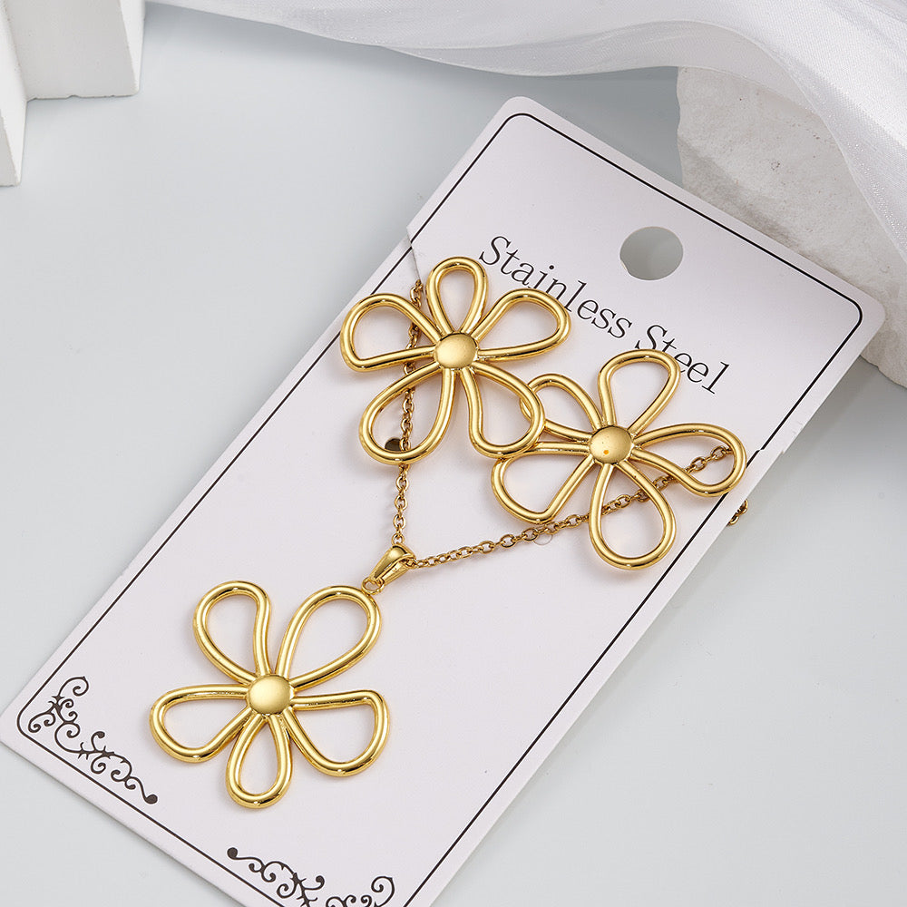 Set de collar + aretes flores- acero inoxidable