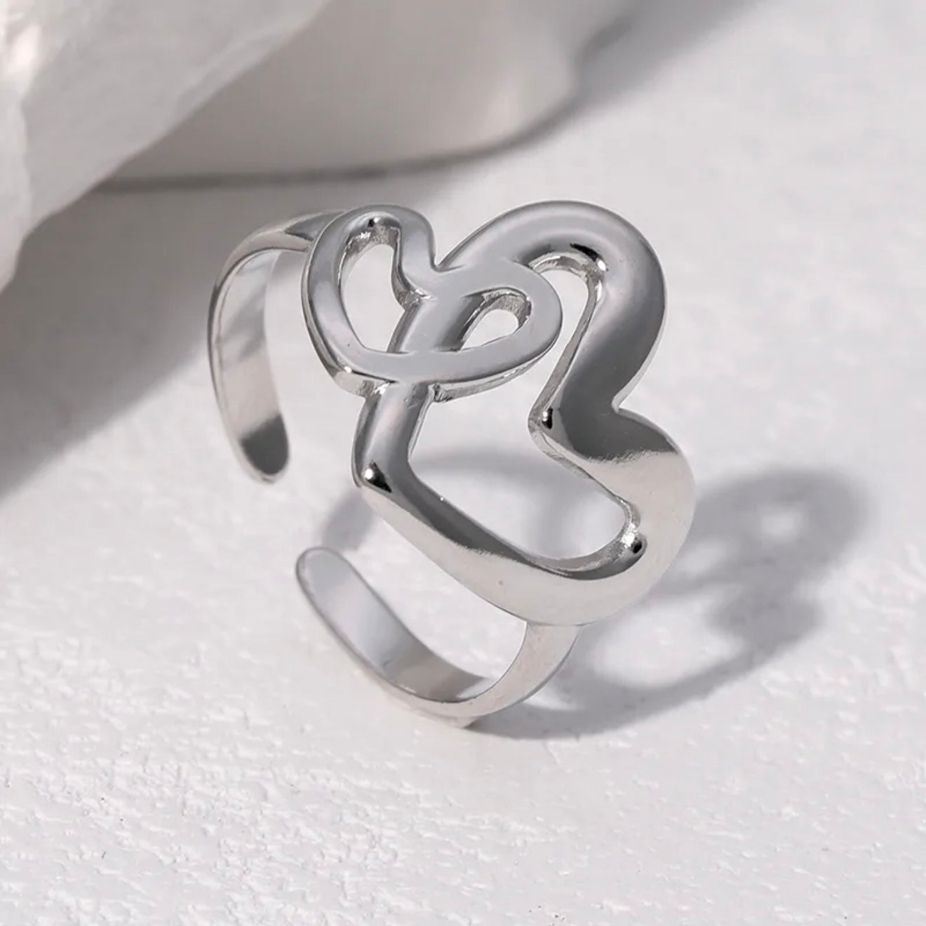 Anillo ajustable dos corazones plateado / Acero inoxidable