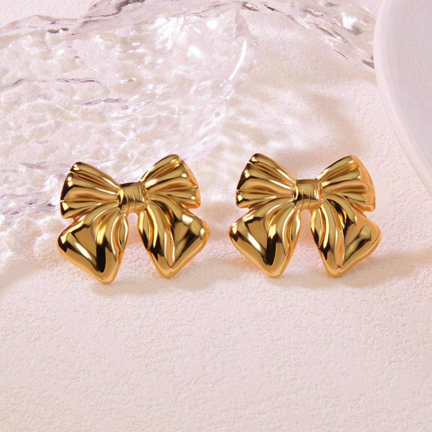 Aretes moños dorados- acero inoxidable