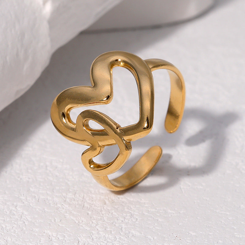 Anillo ajustable dos corazones dorado / Acero inoxidable