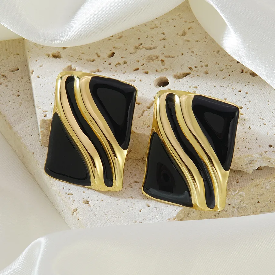 Aretes dorado con negro - acero inoxidable