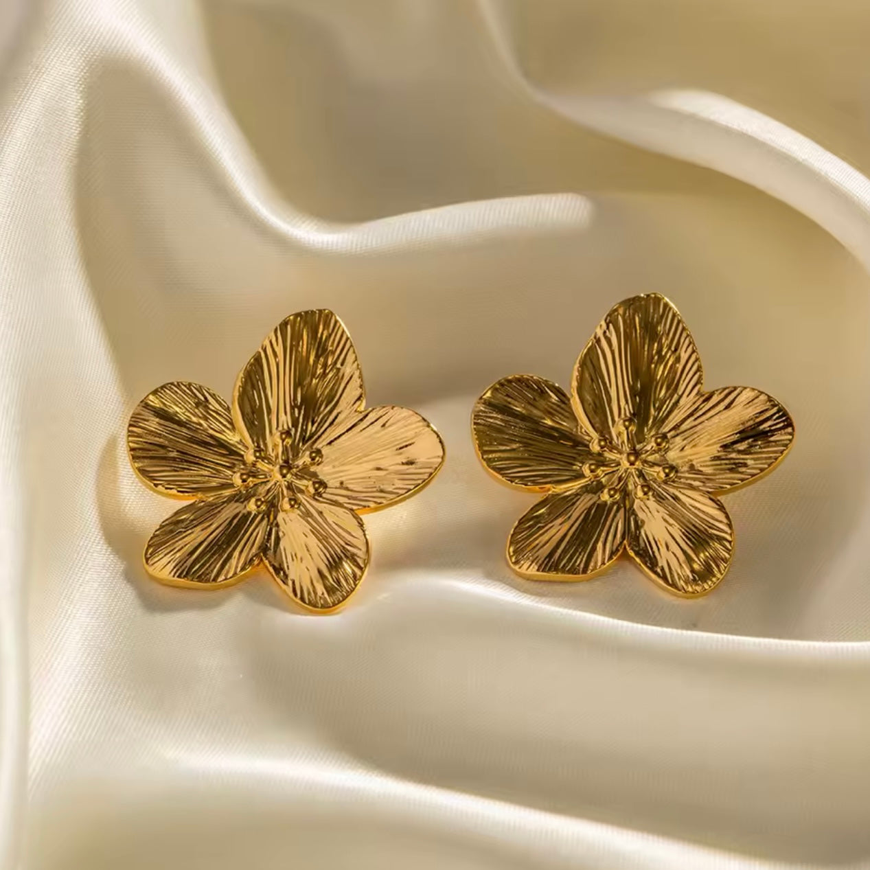 Aretes de flores de acero inoxidable