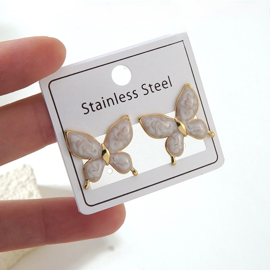 Aretes mariposas blancas- acero inoxidable