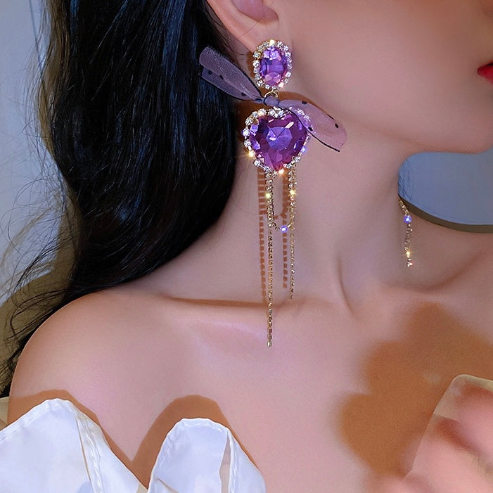 Aretes largos de corazones morados