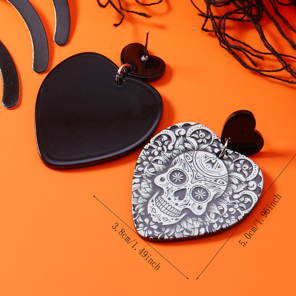 Aretes corazones con calaveras