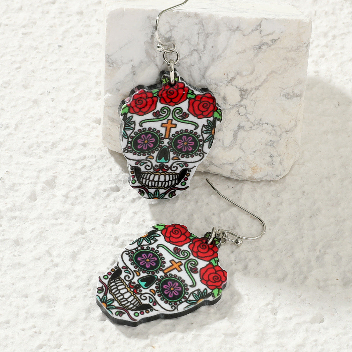 Aretes de calaveras con flores