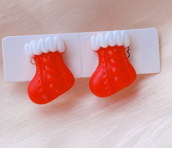 Aretes de clip botas navideñas