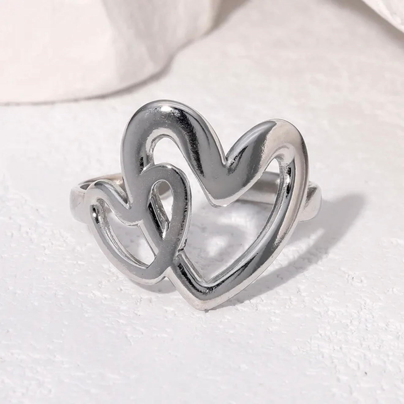 Anillo ajustable dos corazones plateado / Acero inoxidable
