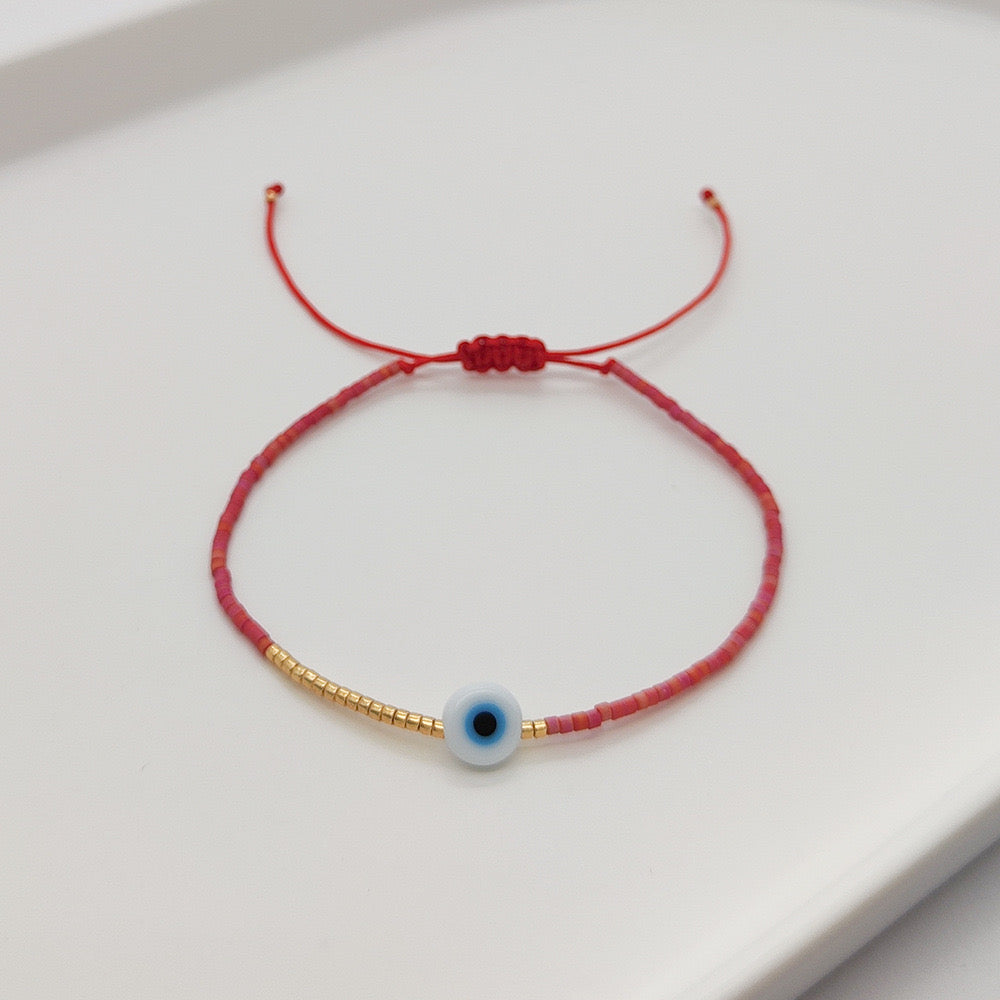 Pulsera ojito- rojo pálido