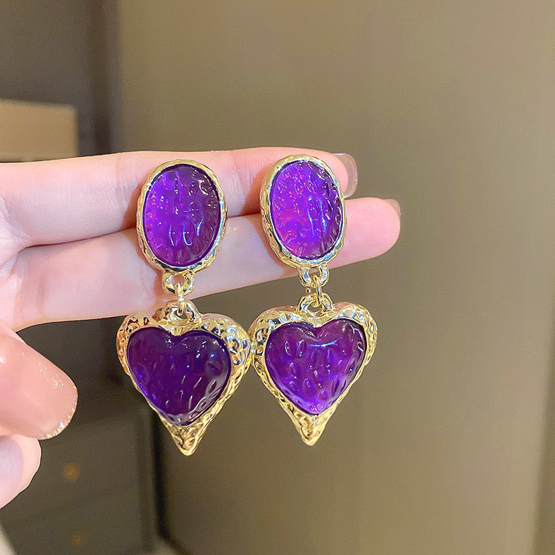 Aretes de corazones morados
