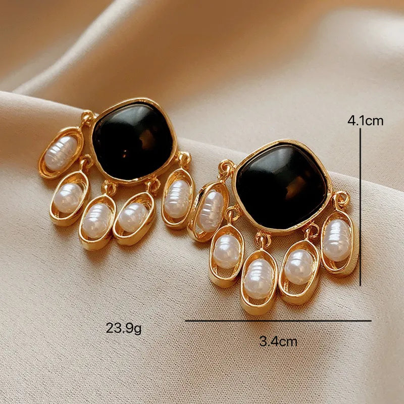 Aretes negros con perlas