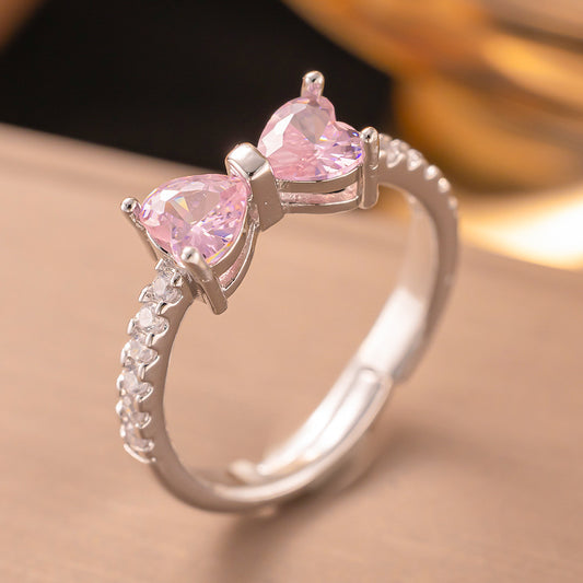 Anillo ajustable plateado lazo rosa  / Acero inoxidable