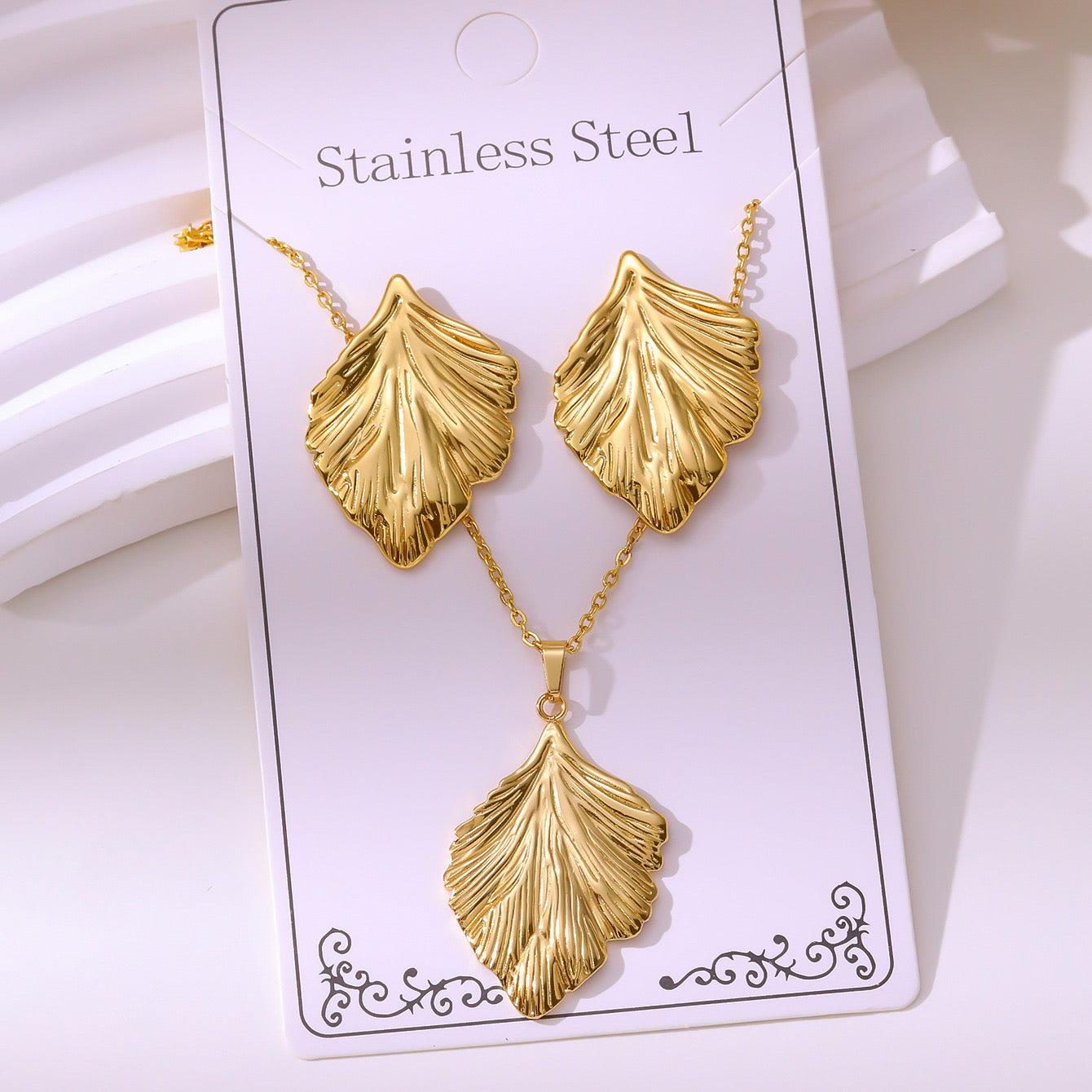 Set de collar + aretes hojitas - acero inoxidable