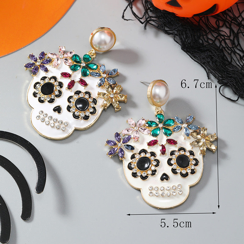 Aretes de calaveritas con pedrería