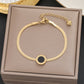 Pulsera con dije de círculo negro - acero inoxidable