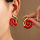 Aretes espiral rojo - acero inoxidable