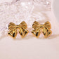 Aretes moños dorados- acero inoxidable
