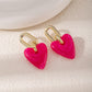 Aretes corazones rosados