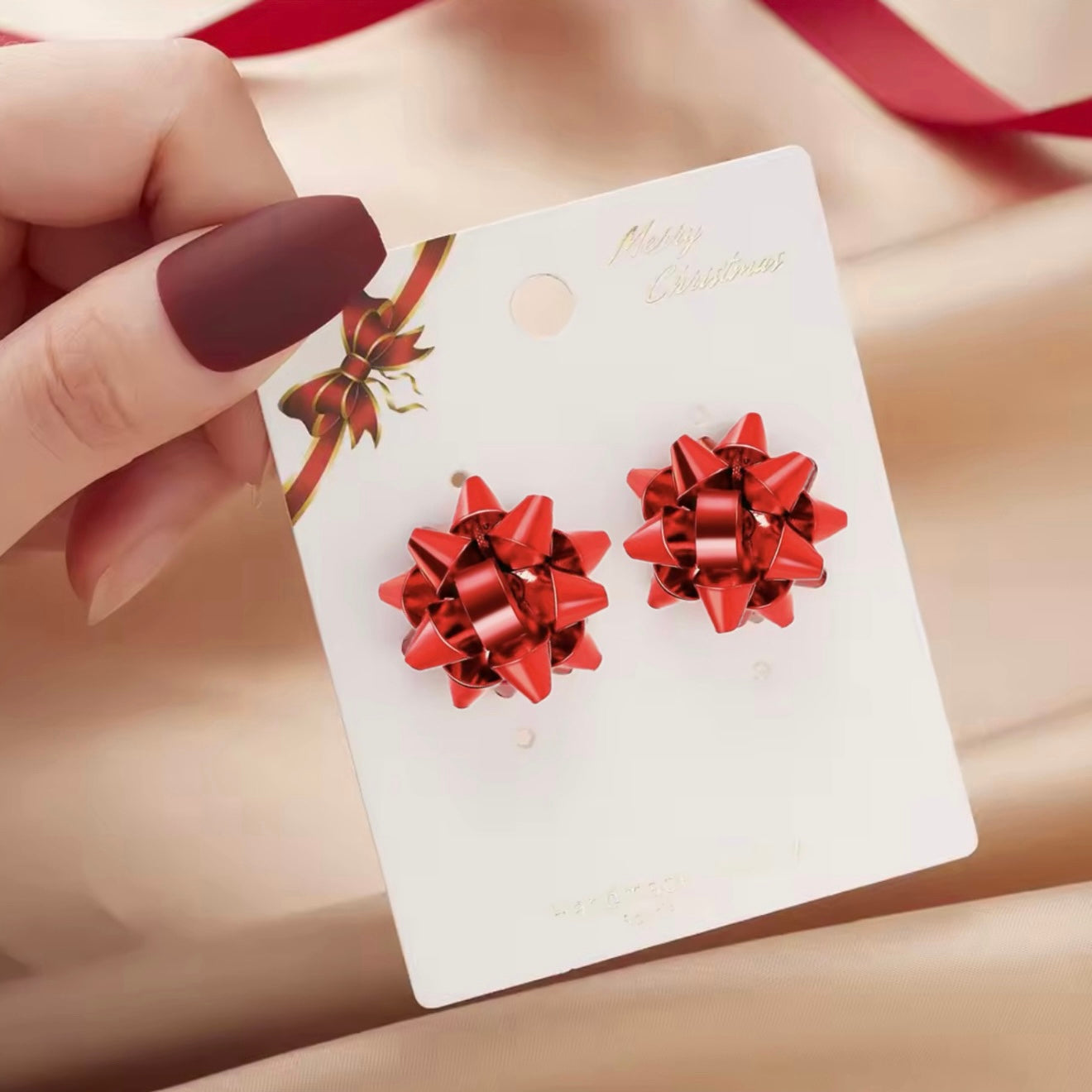 Aretes de moño rojo