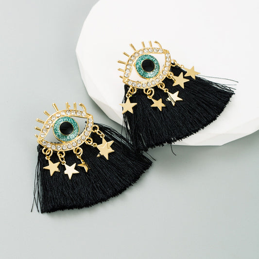 Aretes de ojitos con hilos negros