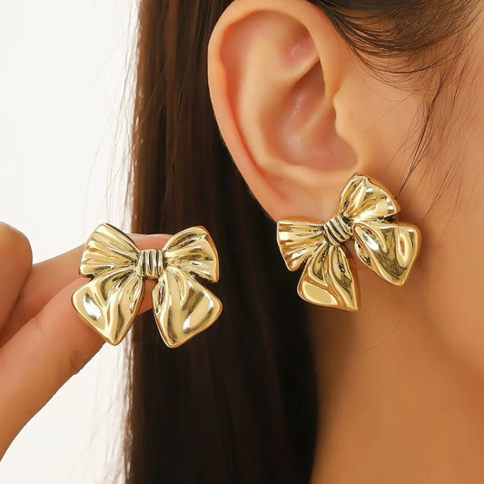 Aretes moños dorados- acero inoxidable