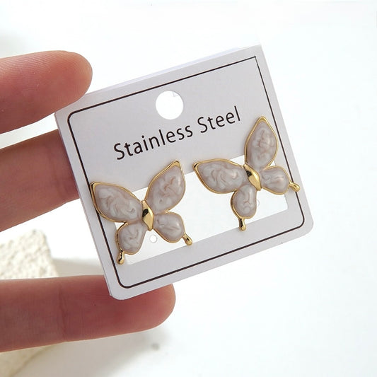 Aretes mariposas blancas- acero inoxidable