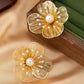 Aretes de flores doradas grandes