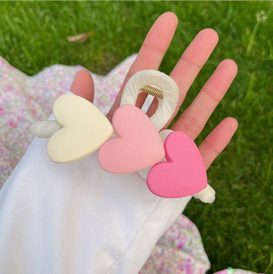 Pinza para cabello de corazones rosados