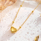 Collar de acero inoxidable con bolitas y corazón