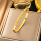 Brazalete dorado con piedritas - Acero inoxidable