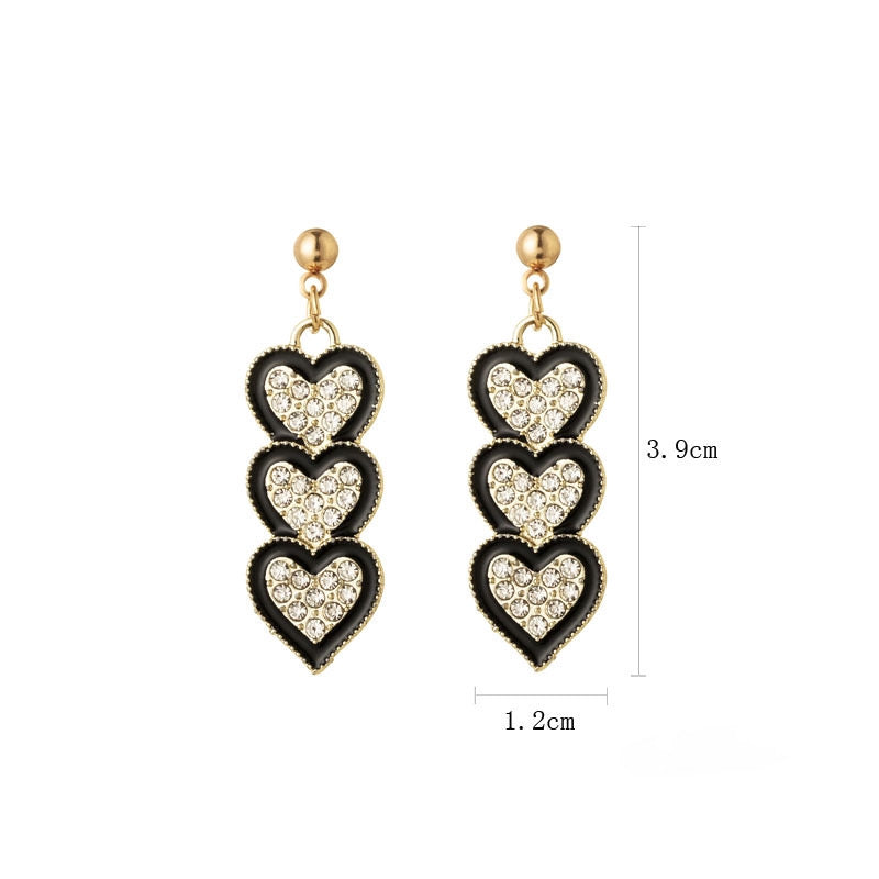 Aretes de corazones negros con plata