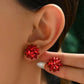 Aretes de moño rojo