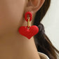 Aretes de corazones rojos