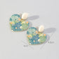 Aretes corazones con hojas