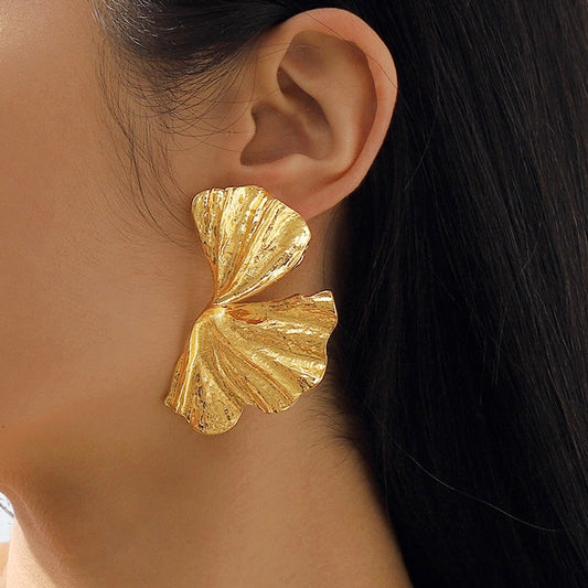 Aretes de abanicos cruzados