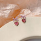 Aretes de corazón morados escarchados