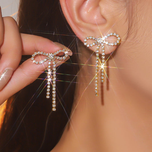 Aretes de lazos plateados
