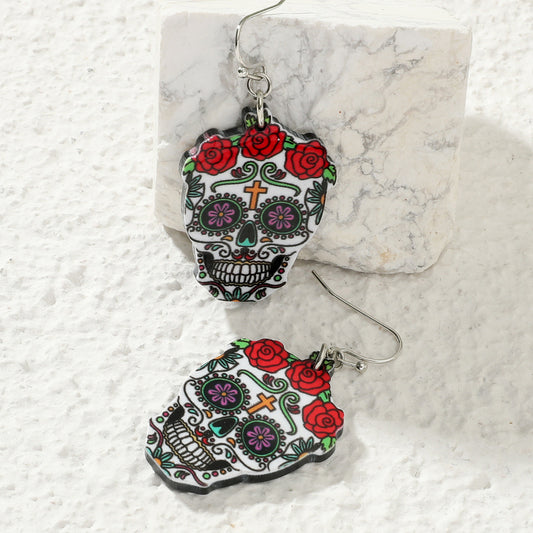 Aretes de calaveras con flores