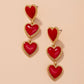 Aretes largos de corazones rojos