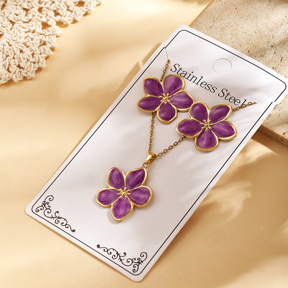 Set de collar + aretes flores moradas - acero inoxidable