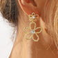 Aretes flores doradas