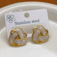 Aretes cruzados blanco y dorado- acero inoxidable