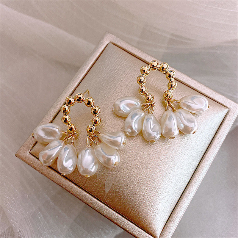 Aretes dorado y blanco