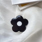 Popsocket- soporte de agarre para teléfono- flor negra