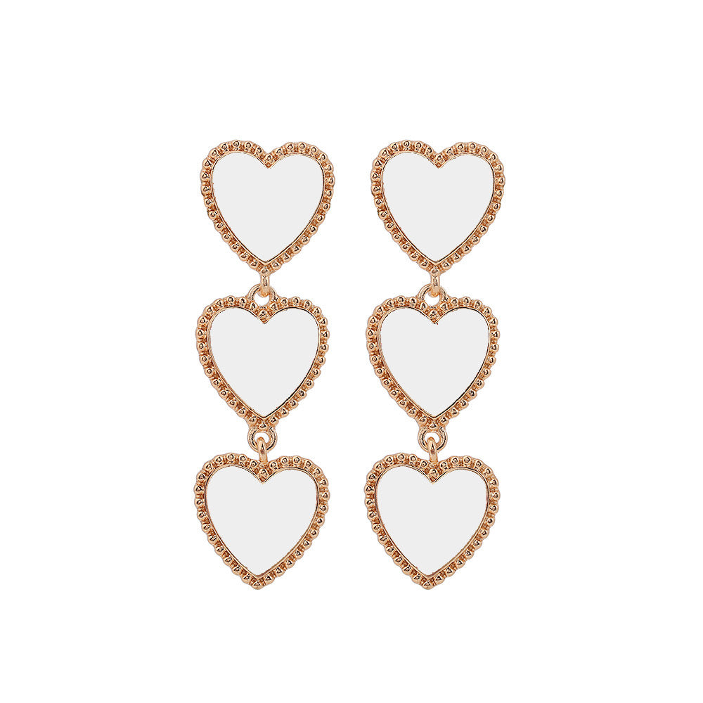 Aretes largos corazones blancos