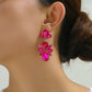 Aretes largos con pedrería rosa