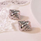 Aretes caracoles plateados- acero inoxidable