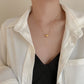 Collar de acero inoxidable con bolitas y corazón