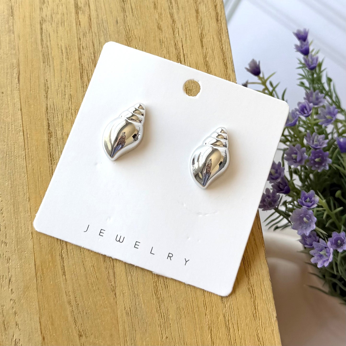 Aretes caracoles plateados